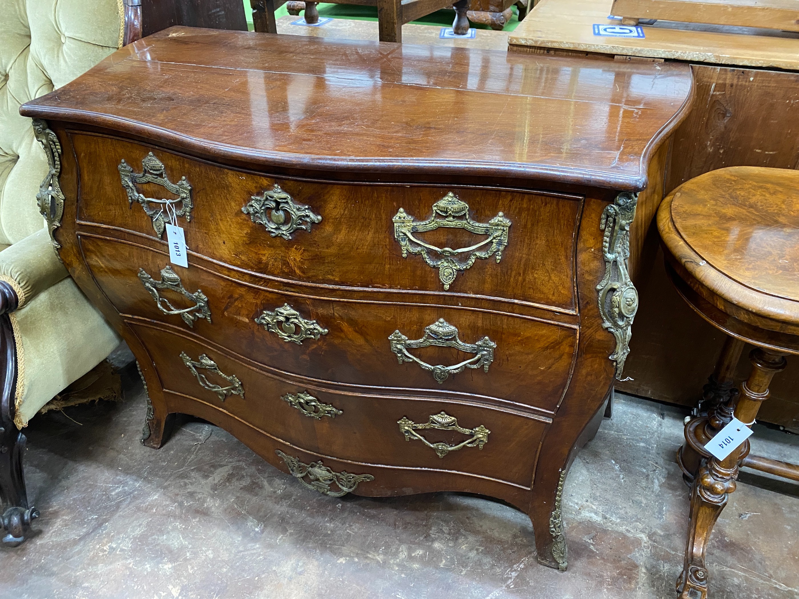 An 18th century Dutch walnut bombe commode, width 109cm, depth 55cm, height 83cm